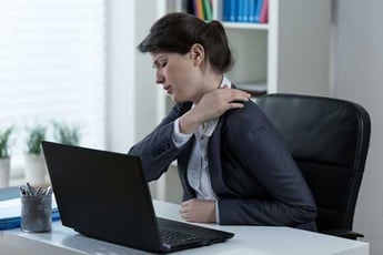 Woman with pain from a neck spasm