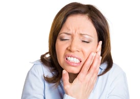 Person with TMJ pain 