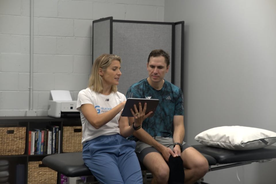 Dr. Annie discussing running assessment results with a patient