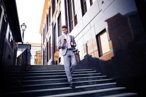 A man walking downstairs with decreased hip tendonitis