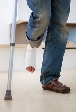 Man in cast from a rolled ankle