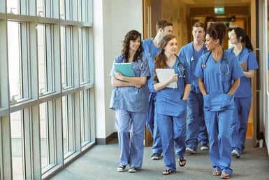 Medical students walking through corridor at the university