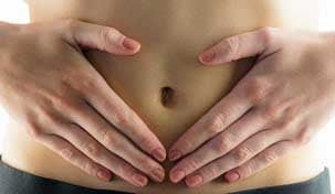 Person touching lower abdomen