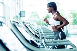 A person running, causing extra strain on their pelvic floor