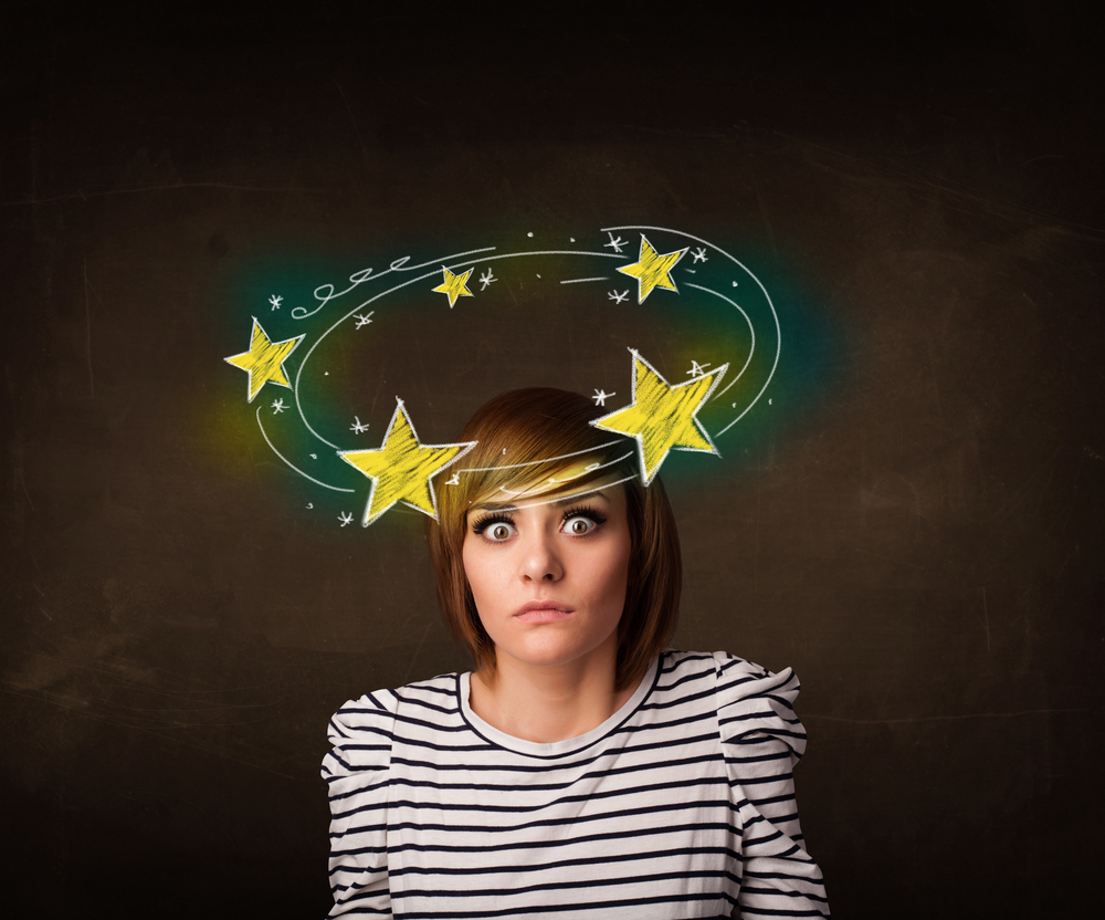 A woman experiencing cervicogenic dizziness and vertigo